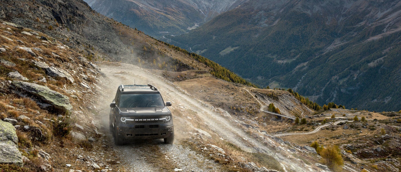 2026Ford-Bronco-ExteriorDrivingHeadOnAlongElevatedMountainRoad