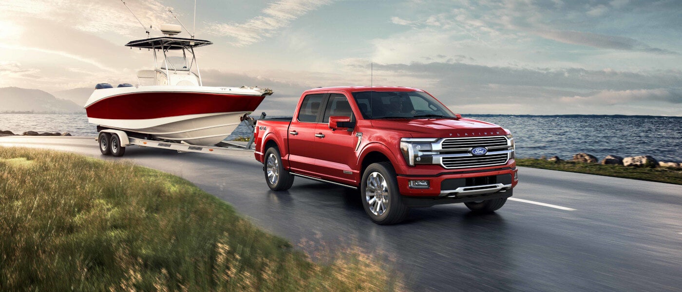 2026Ford-F150-ExteriorTowingABoatByLake
