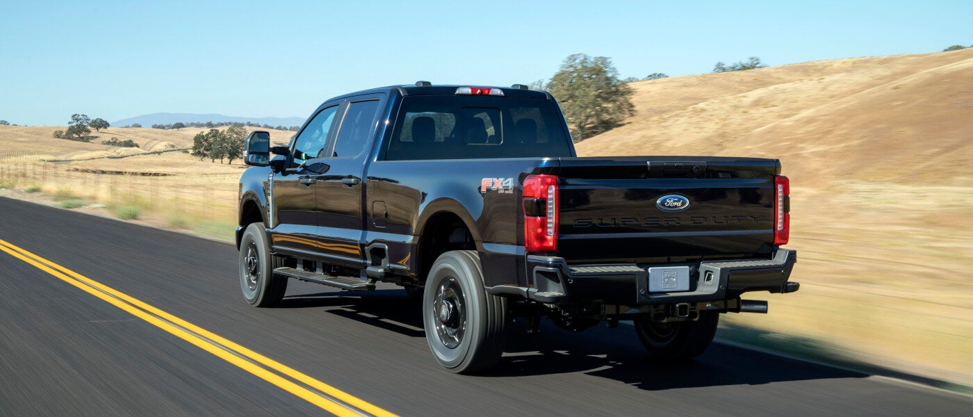 2026Ford-SuperDuty-ExteriorFromBehindDrivingOnHighway